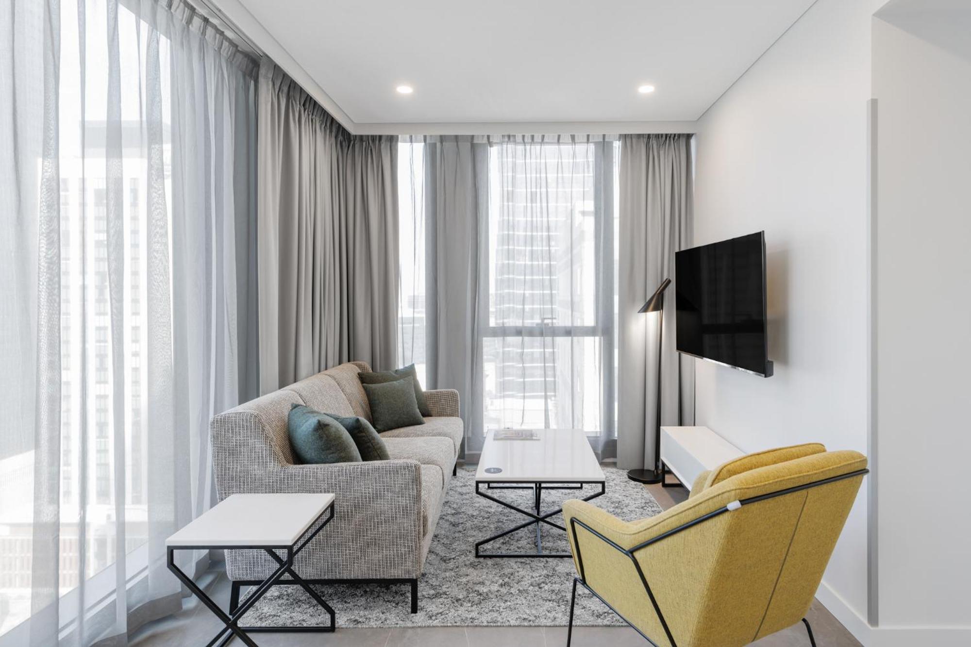 Meriton Suites Melbourne Exteriör bild A living room in a typical apartment